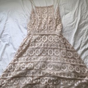 Lace patterned dress with spaghetti straps.